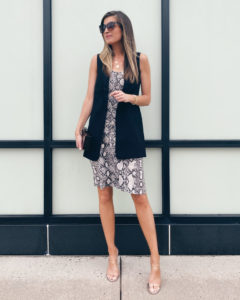styling a snakeskin midi dress with a black sleeveless blazer vest