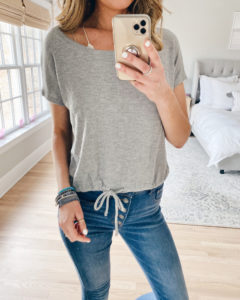 casual mom outfit for spring - gray soft mesh waffle tie hem tee with button fly ankle jeans