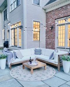 diy patio string lights and artificial flower planters