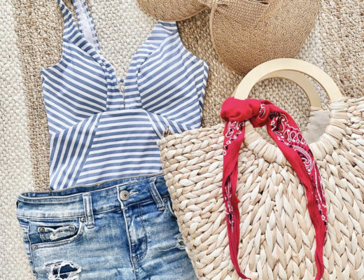 Walmart blue stripe one piece swimsuit with American Eagle midi shorts sleeve society straw bag and woven visor flat lay summer beach outfit