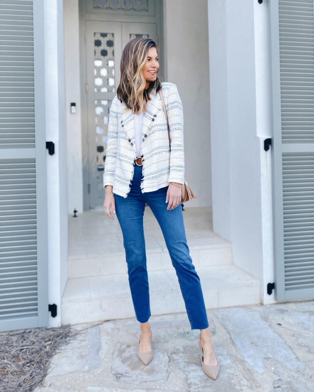 coastal style draped boucle blazer outfit with jeans and heels