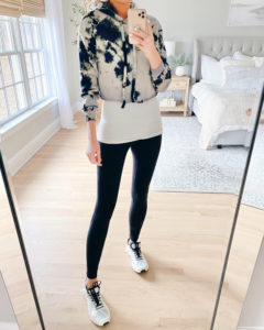 cropped tie dye hoodie with layering tank and black leggings